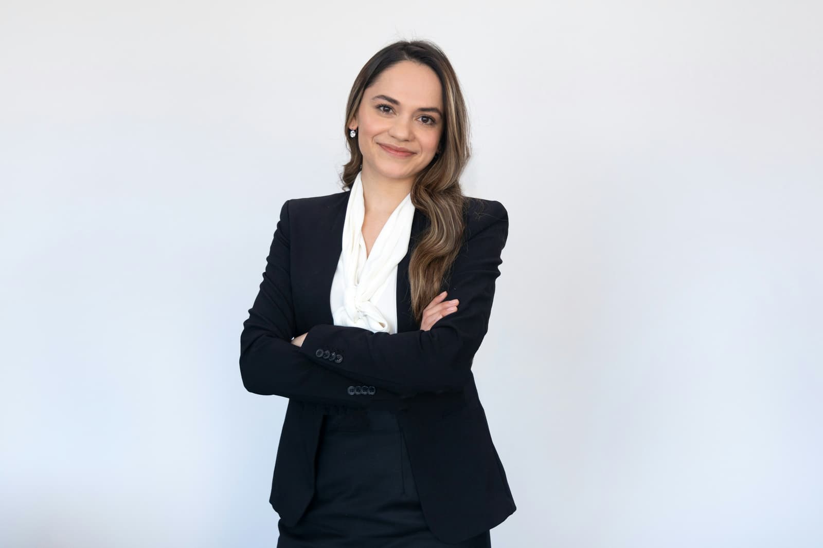 Professional woman attorney in business suit with arms crossed