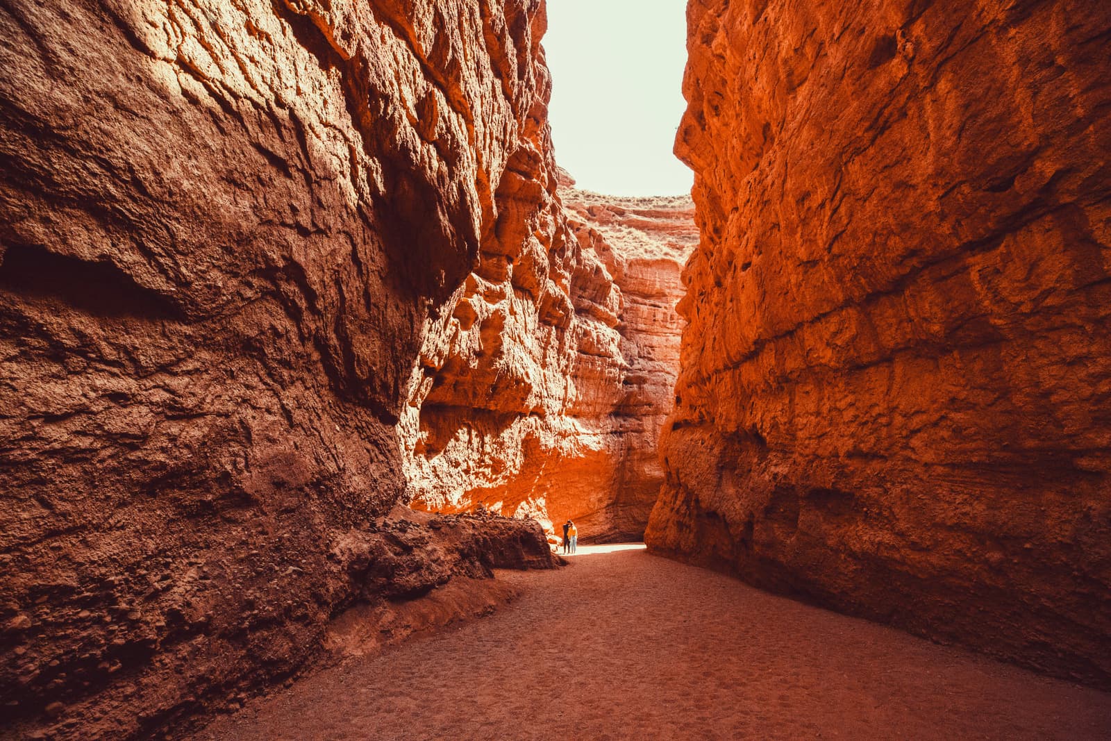 Red sandstone canyon walls towering overhead