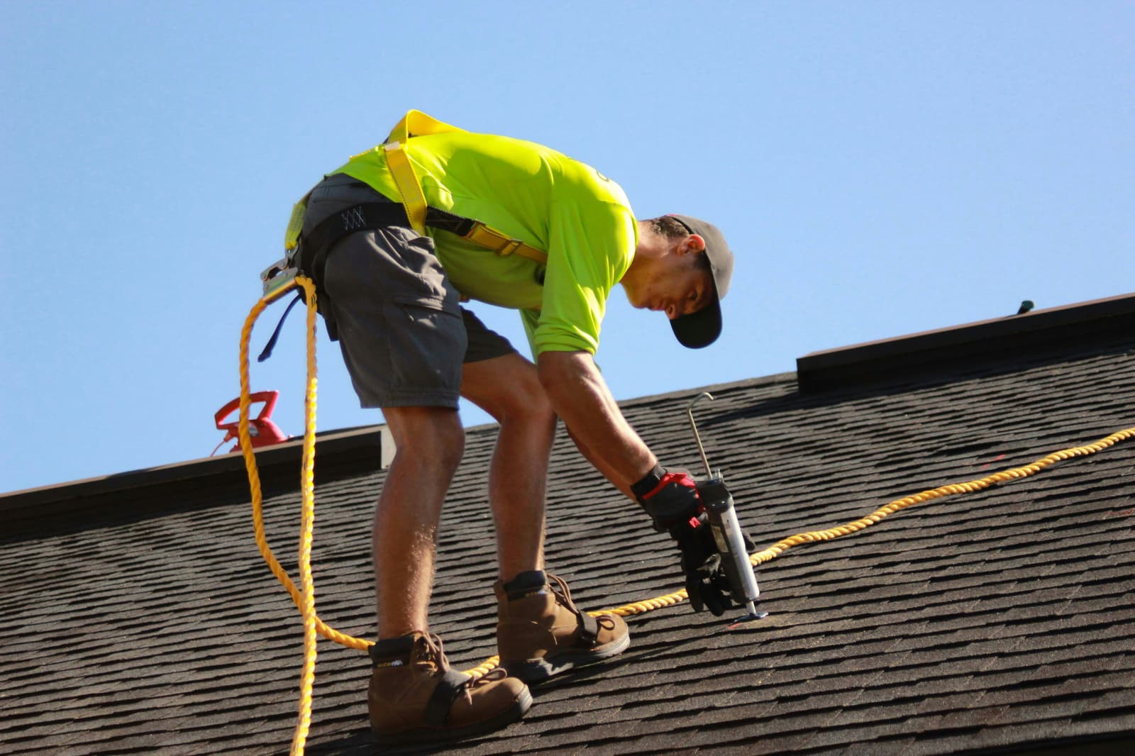 Aerial view of a residential rooftop with new shingles installed